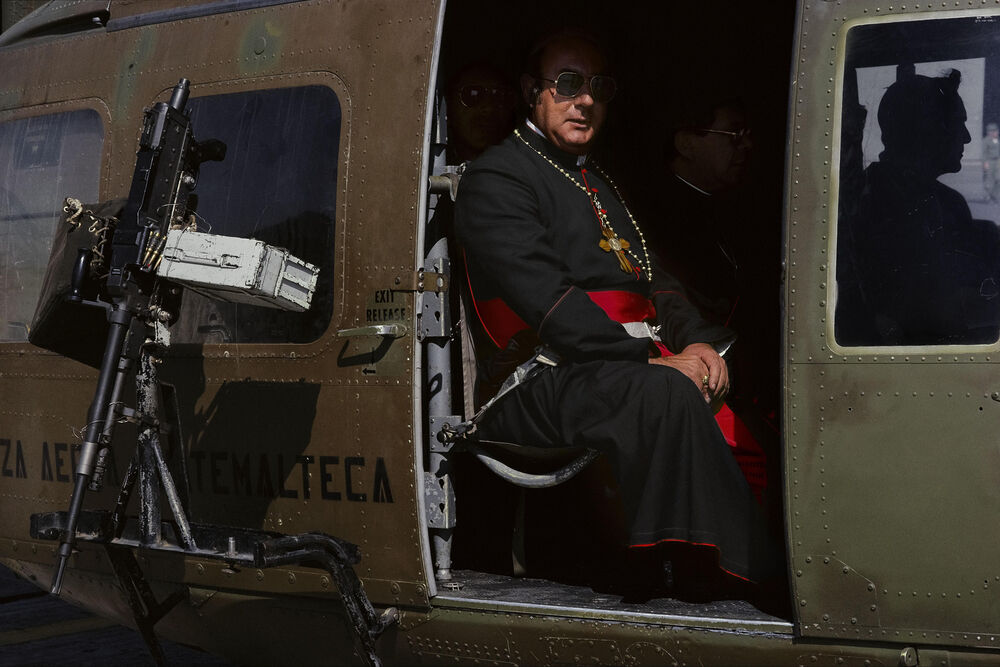 Guatemala. Clergy traveled in military helicopters to the mass of  Pope John Paul II in the war zone. Fra Deeds of War
